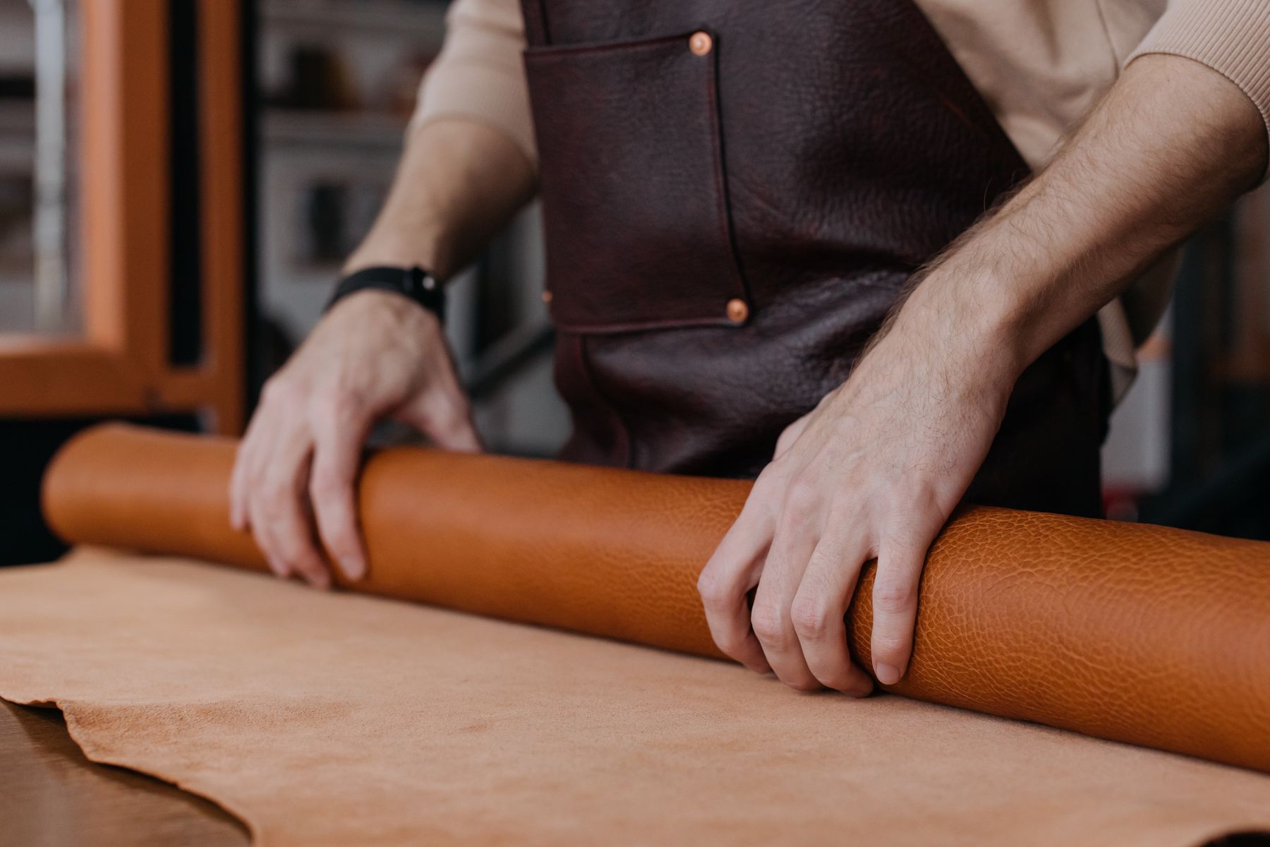 Hand-rolled leather on a workbench